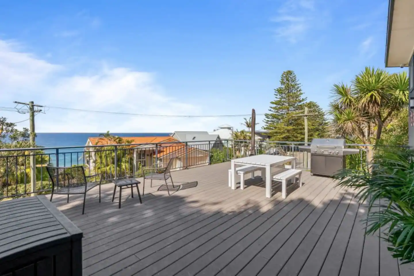 huge-deck-water-views-sandcastle-studio-forresters-beach-holiday-home-coast-hosting